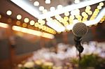 Close Up Of Microphone In Concert Hall Or Conference Room Stock Photo