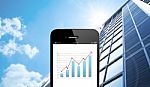 Close Up Smart Phone Against Business Building With Blue Sky Bac Stock Photo