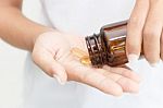Closeup Hand Holding Fish Oil Vitamin For Healthy Stock Photo