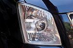 Closeup Headlights Of Modern Black Car With Projector Lens Stock Photo