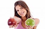 Closeup Of A Girl Giving Apple In Both Hands Stock Photo