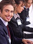 Closeup Of Attractive Business Men With Colleague Stock Photo