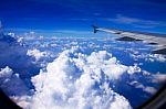 Clouds And Sky As Seen Through Window Of An Aircraft Stock Photo