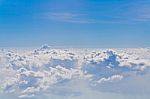 Clouds And Sky Blue, Viewed From An Airplane Window Stock Photo