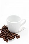 Coffe Beans With A Cup And Spoon Stock Photo