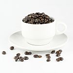Coffee Beans In Coffee Cup Isolated On White Stock Photo