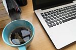 Coffee Cup On Table Wood With Bulr Labtop And Book Stock Photo