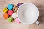 Coffee Cup With Colorful Macarons Stock Photo