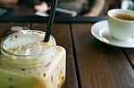 Coffee, Iced Coffee On Table Wood In Cafe In Front Of Blur Women Stock Photo