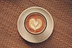 Coffee Latte Art On Tablecloth Texture Background Stock Photo