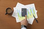 Coffee On Worktable Covered With Documents Close Up Stock Photo