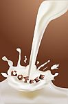 Coffee Text In Splash Of Milk Stock Photo