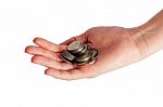 Coins Piled Up In Womans Hand Stock Photo