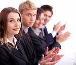 Colleagues Applauding During A Business Meeting Stock Photo