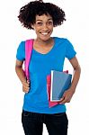 College Student Carrying Back Pack, Book And Clipboard Stock Photo