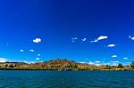 Colorado River And Mountains And Dredging Barge Under Blue Sky Stock Photo