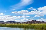 Colorado River And Mountains Under Blue Sky Stock Photo