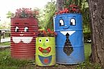 Colorful Flower Pots Made Of Metal Barrel Stock Photo