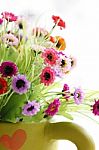 Colorful Is Flowers In A Green Vase Stock Photo