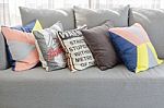 Colorful Pillows On Modern Grey Sofa In Living Room Stock Photo