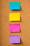 Colorful Sticky Notes On Corkboard Stock Photo