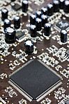 Computer Chip On Brown PCB  Stock Photo
