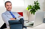 Confident Businessman At His Workstation Stock Photo