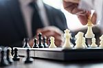 Confident Businessman Colleagues Playing Chess With Colleague To Stock Photo