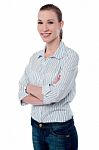 Confident Businesswoman With Folded Arms Stock Photo