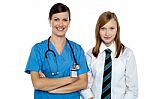 Confident Medical Expert Posing With School Girl Stock Photo