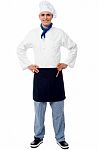 Confident Young Cook Posing In Uniform Stock Photo