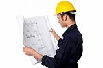 Construction Worker Reviewing Plan Stock Photo