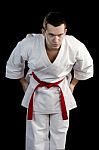 Contrast Karate Young Fighter On Black Stock Photo