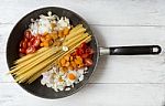 Cooking Spaghetti With Vegetables And Herbs Stock Photo
