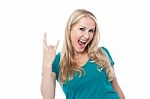 Cool Caucasian Showing Rock On Gesture Stock Photo