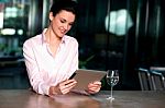 Corporate Lady Operating New Tablet Device Stock Photo