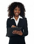 Corporate Lady Writing On Clipboard Stock Photo
