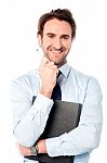 Corporate Man Holding Important File Stock Photo