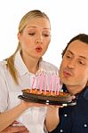 Couple Celebrating Birthday With Cake Stock Photo