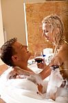 Couple Having Bath With Wine Stock Photo