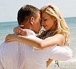 Couple Hugging At Beach Stock Photo