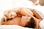 Couple Making Love In Bed Stock Photo