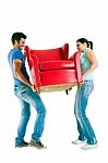 Couple Moving Armchair Stock Photo