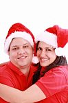 Couple Wearing Santa Hats Stock Photo