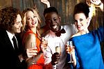 Couples Enjoying Champagne Or Wine At A Party Stock Photo