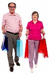 Couples Holding Shopping Bags Stock Photo