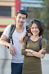 Couples Of Younger Asian Man And Woman Relaxing With Happy Face On Vacation Trip Stock Photo