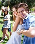 Couples Playing Tug Of War Game Stock Photo