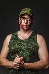 Creative And Funny Military Style Camouflage On Tankman Face Stock Photo
