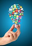 Creative Light Bulb Idea In Hand With App Cloud Stock Photo